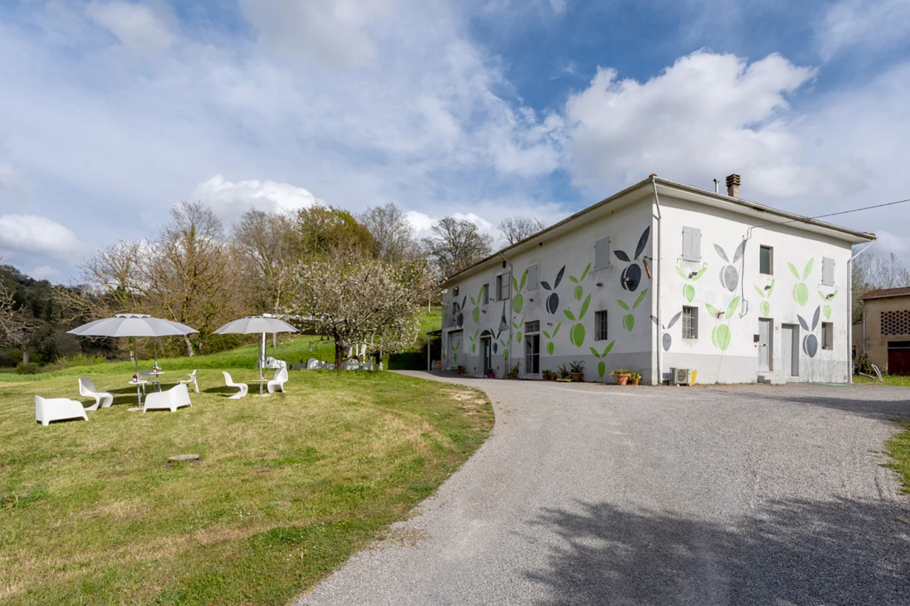 View of the Inserrata farm in San Miniato, garden with an area dedicated to traditional wine tasting.
